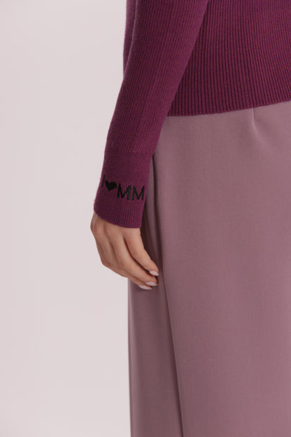 MAGLIA CON RICAMO SUL POLSO