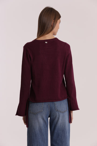MAGLIA SCOLLO TONDO CON FIOCCHI SULLA MANICA