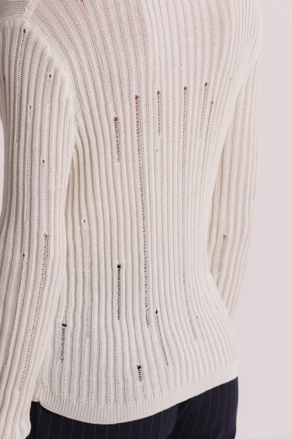MAGLIA CON DETTAGLI SMAGLIATI