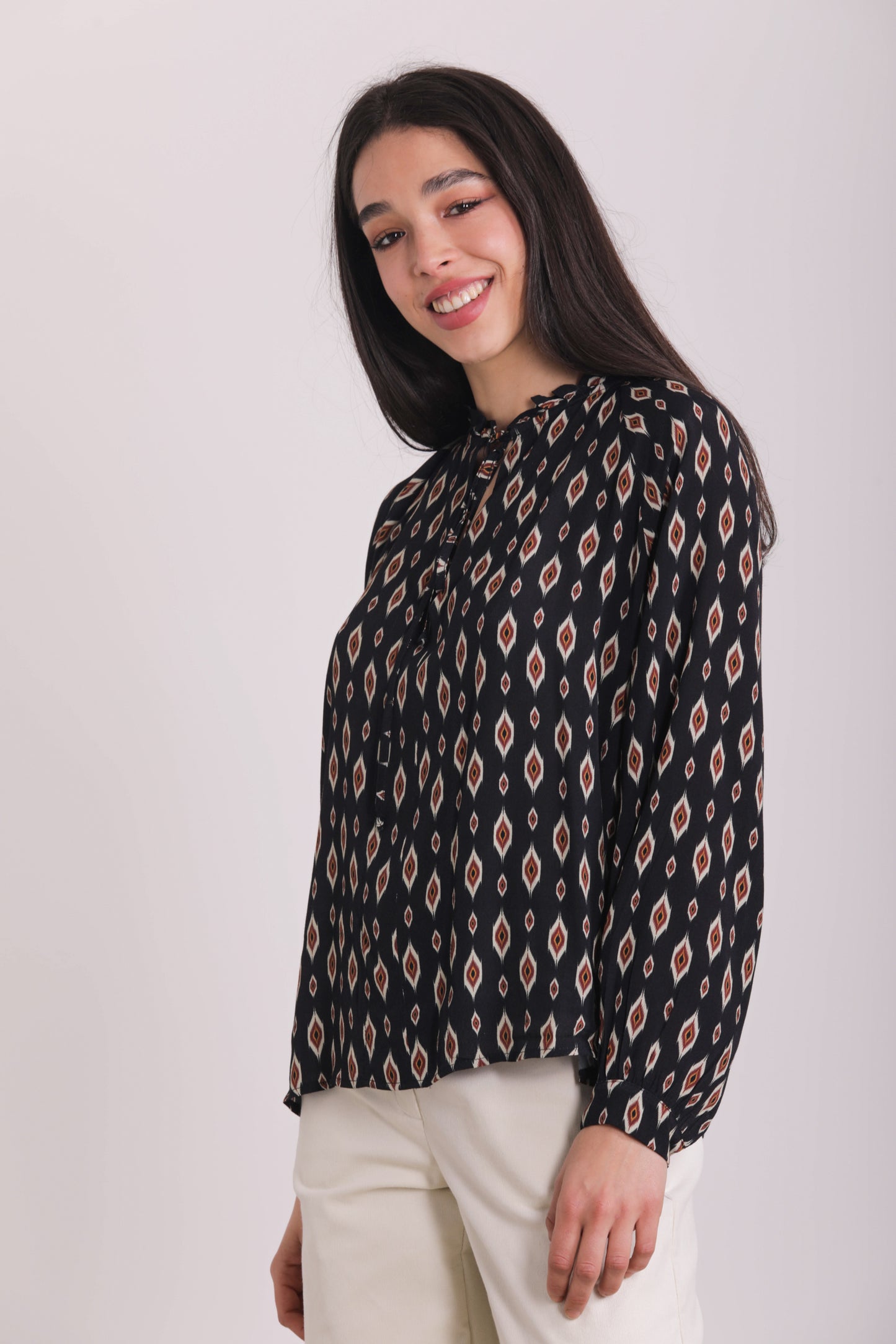 BLUSA CON ROUCHES FANTASIA ROMBI STILIZZATI