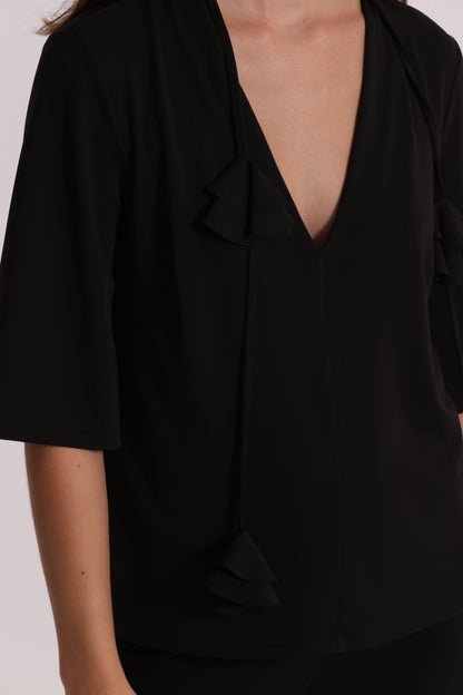 BLUSA CON SCOLLO A V E DETTAGLIO FLOREALE