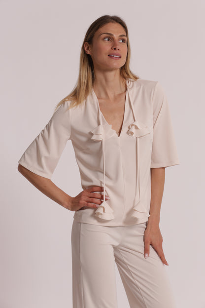 BLUSA CON SCOLLO A V E DETTAGLIO FLOREALE