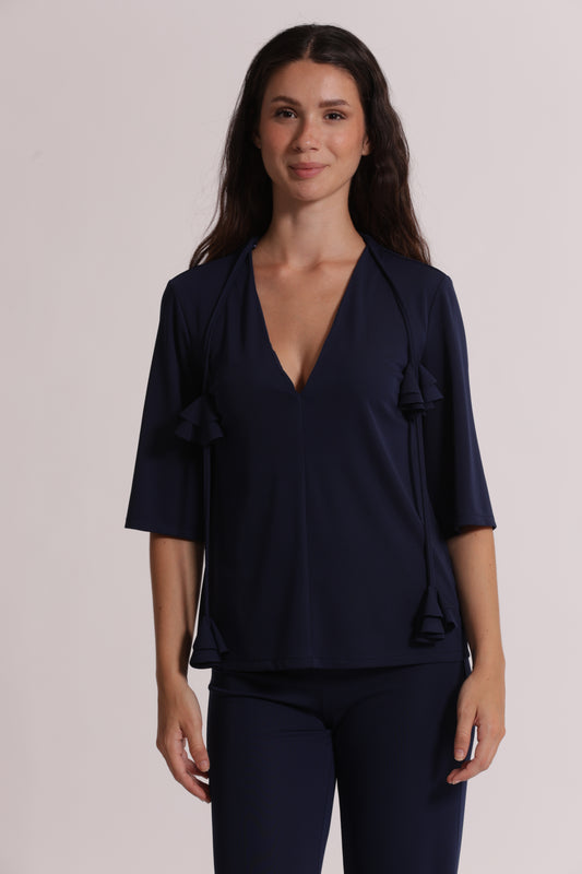 BLUSA CON SCOLLO A V E DETTAGLIO FLOREALE