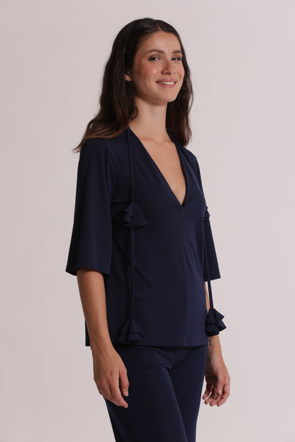 BLUSA CON SCOLLO A V E DETTAGLIO FLOREALE