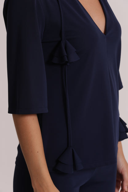 BLUSA CON SCOLLO A V E DETTAGLIO FLOREALE