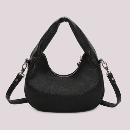 BORSA A MANO CON BORCHIE E OCCHIELLI