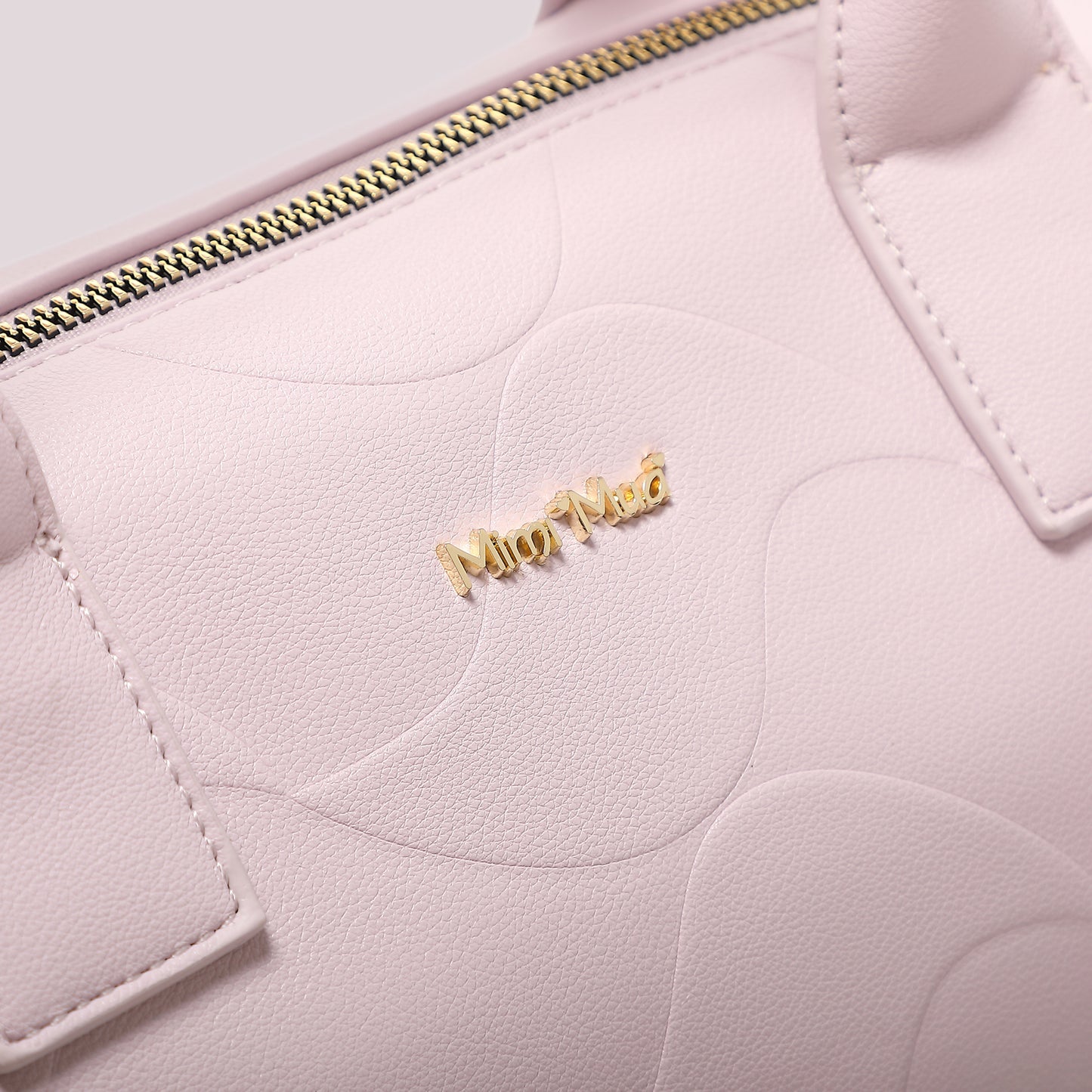 BORSA A BAULETTO CON MOTIVO AD ONDA