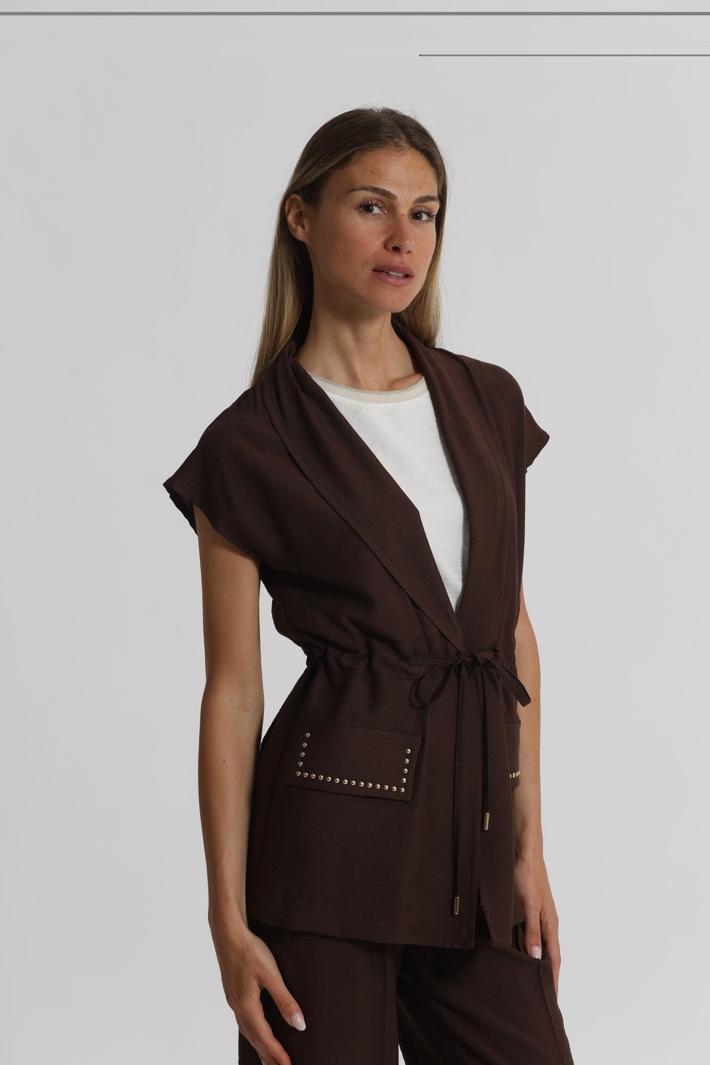 GIACCA CON DETTAGLIO BORCHIE