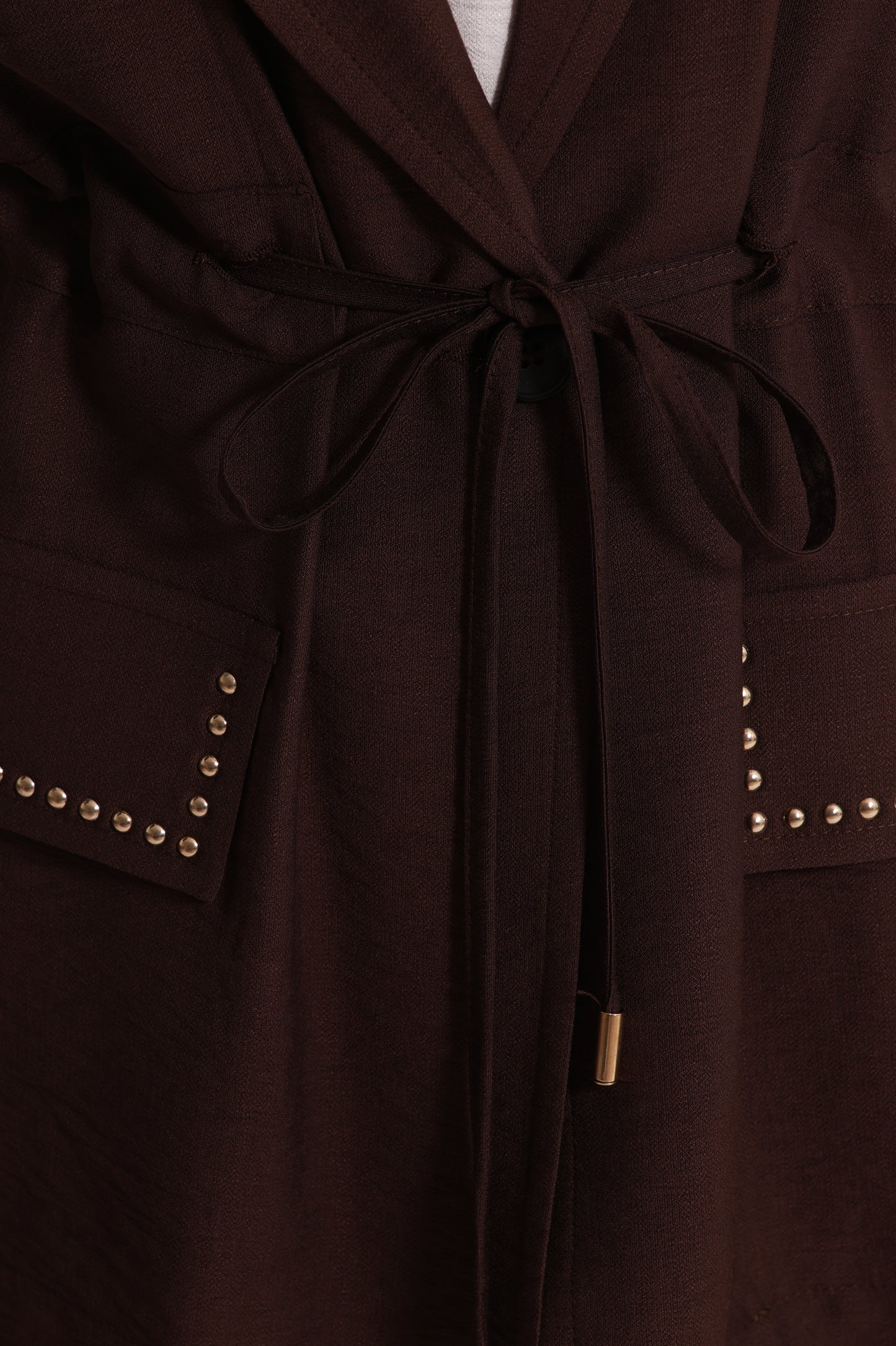 GIACCA CON DETTAGLIO BORCHIE