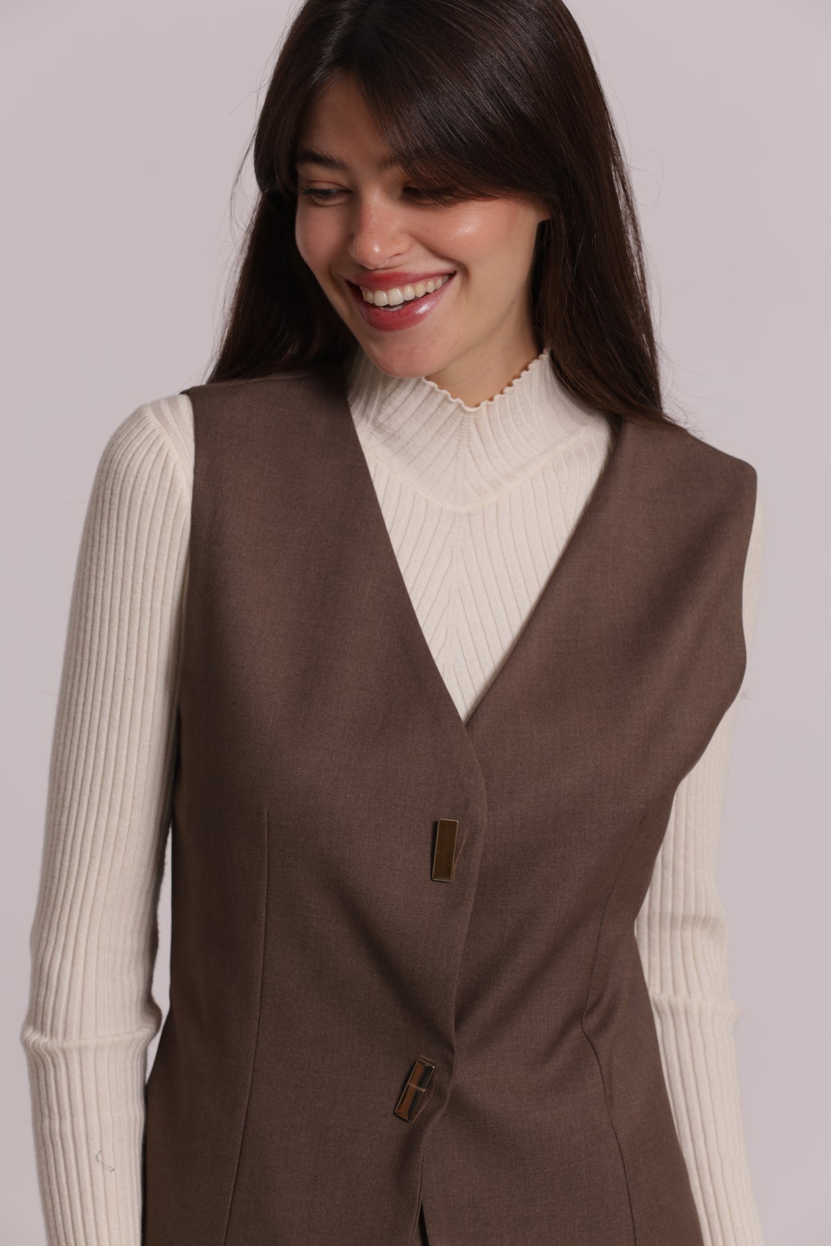 GILET CON BOTTONI METALLICI