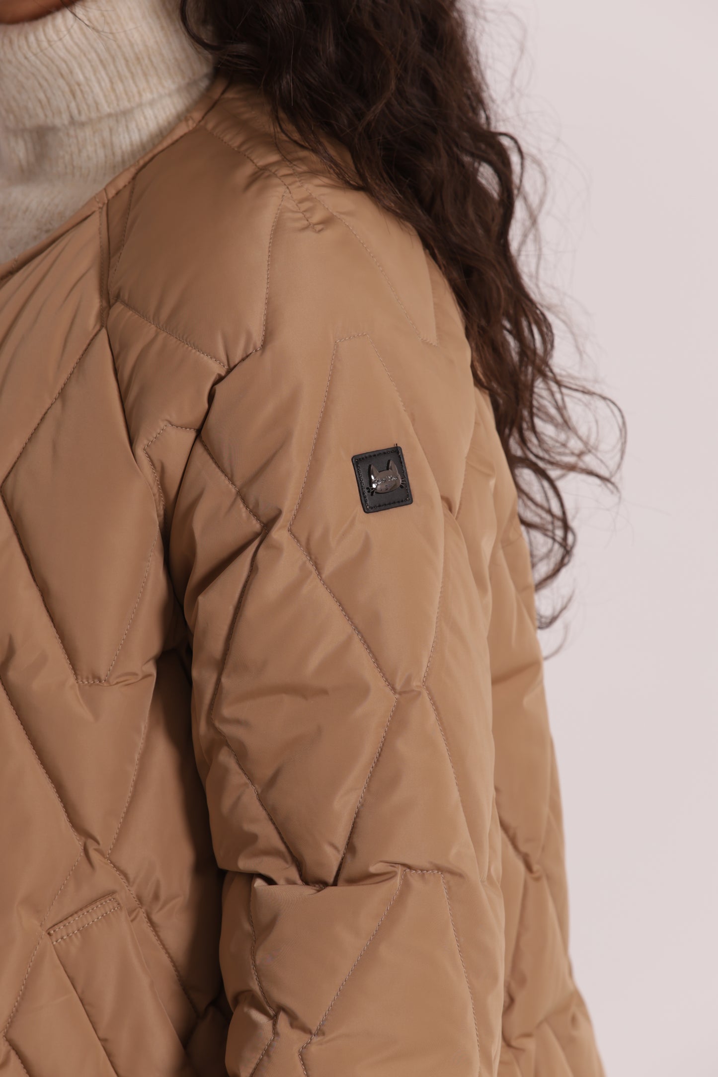 PIUMINO CORTO OVER CON TRAMA ZIG-ZAG