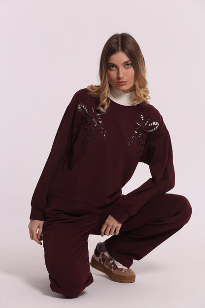 FELPA CON DETTAGLI TRAFORATI E STRASS