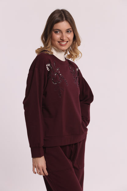 FELPA CON DETTAGLI TRAFORATI E STRASS
