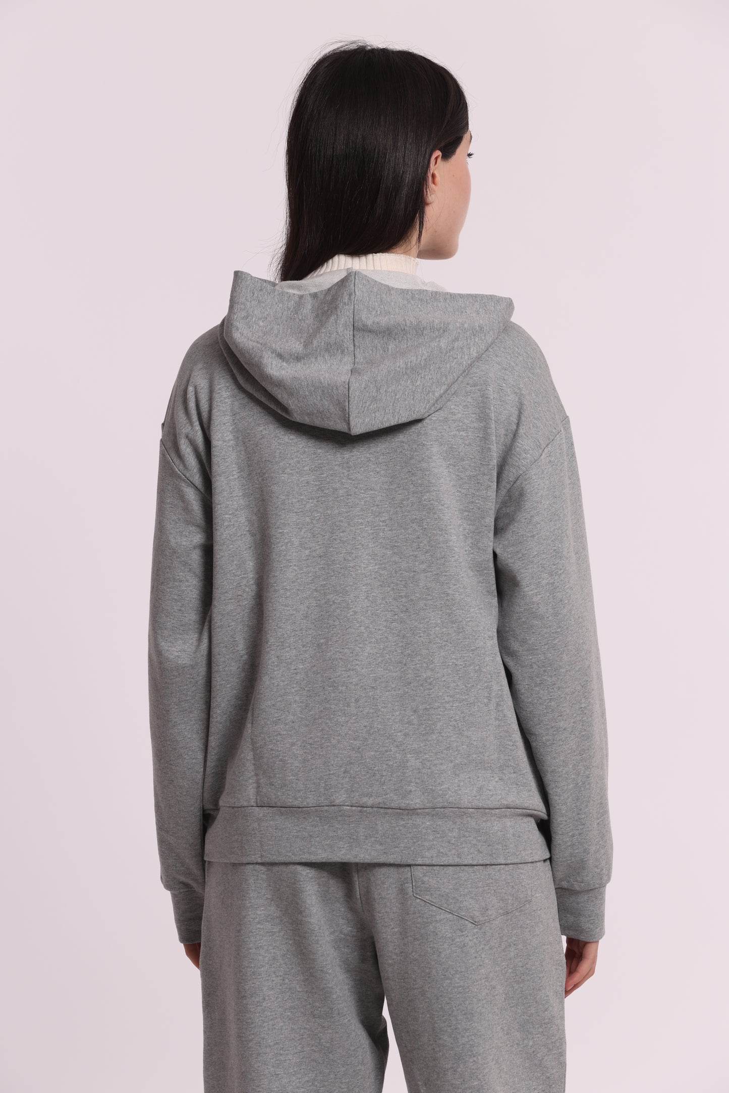 FELPA CON ZIP DETTAGLI TRAFORATI E STRASS