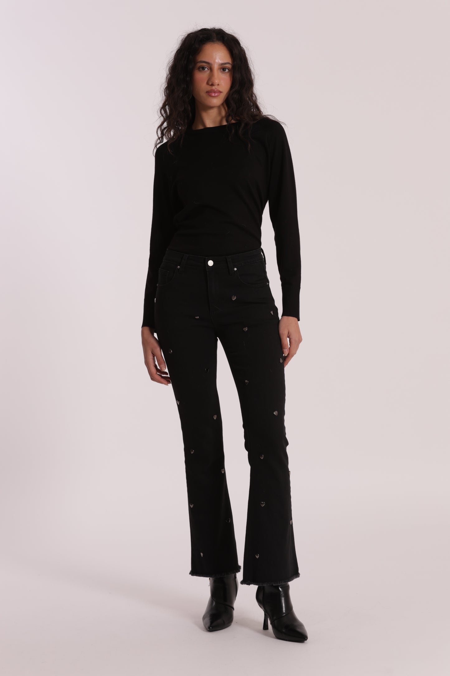 JEANS FLARE CON BORCHIE CUORE