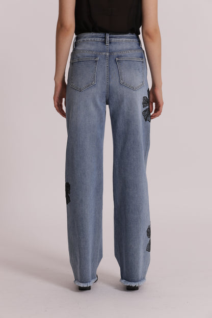 JEANS CON RICAMO FLOREALE