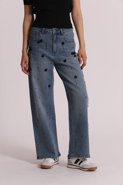 JEANS PALAZZO CON APPLICAZIONI FLOREALI